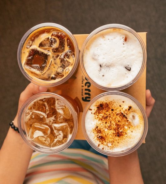 Four iced coffees seen from above in a Berry carrier